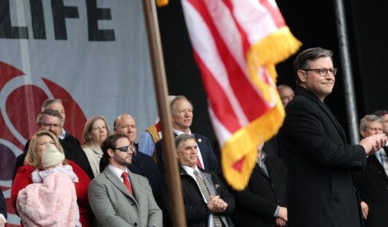 Speaker of the House Mike Johnson applauds on stage alongside fellow Republican lawmakers during the annual March for Life rally on the National Mall on Jan. 23, 2026, in Washington, D.C.