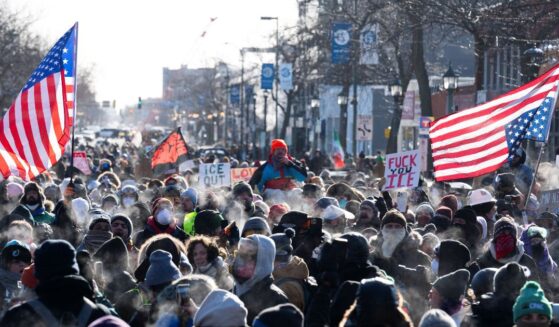 Protesters gather near where a man was shot dead by federal immigration agents in Minneapolis, Minnesota, on Jan. 24, 2026.