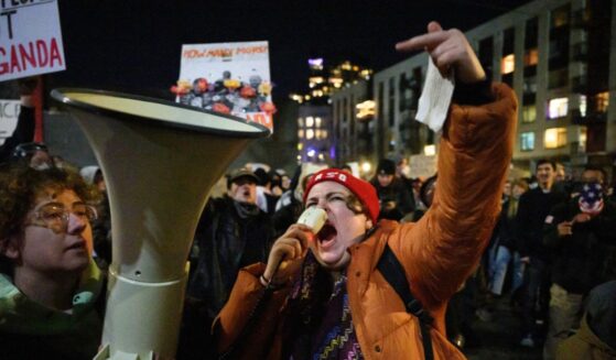 An anti-ICE activist chants and gestures during a protest at the U.S. Immigration and Customs Enforcement facility on Jan. 9, 2026, in Portland, Oregon.