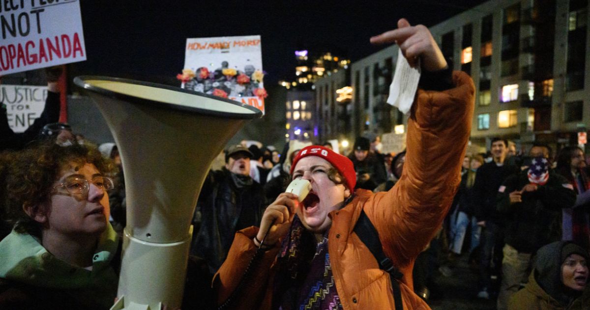 An anti-ICE activist chants and gestures during a protest at the U.S. Immigration and Customs Enforcement facility on Jan. 9, 2026, in Portland, Oregon.