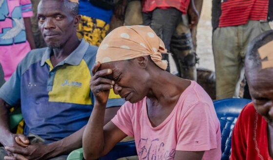 Survivors of Sunday's attack in Kurmin Wali, northwest Nigeria, react during a meeting with Kaduna state Governor Uba Sani Wednesday.