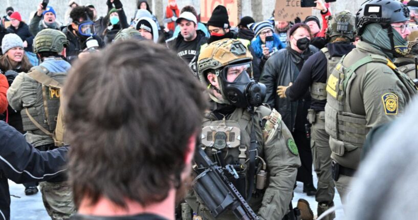 Federal agents confront anti-ICE agitators outside the Bishop Henry Whipple Federal Building in Minneapolis on Jan. 8, 2026.