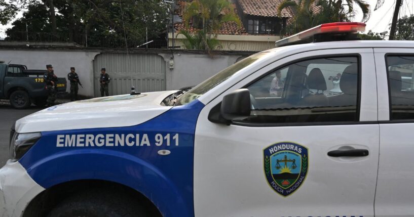 Military police and police pickup guard a street near Elliot Dover Christian School in Tegucigalpa on May 7, 2025.