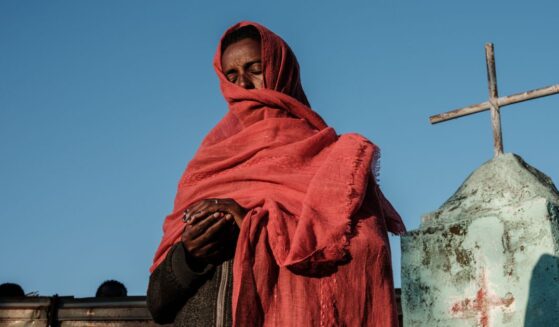 A refugee prays at an Ethiopian Orthodox Church building in eastern Sudan on Dec. 6, 2020.