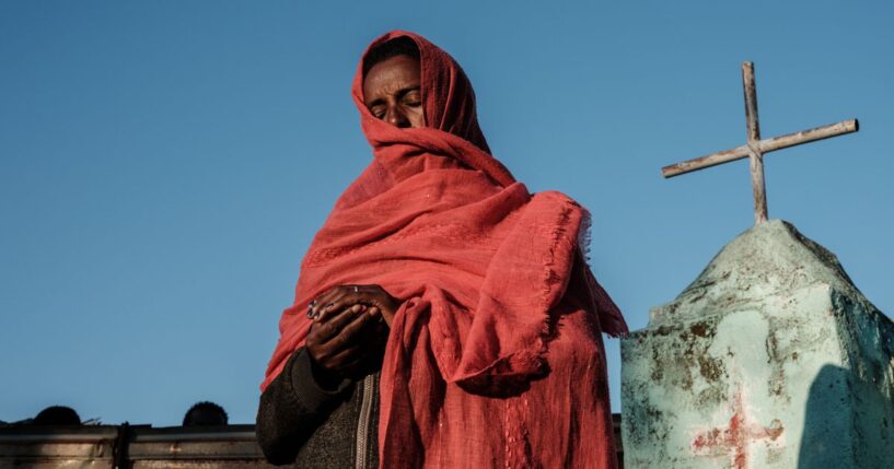 A refugee prays at an Ethiopian Orthodox Church building in eastern Sudan on Dec. 6, 2020.