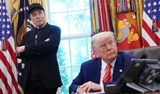 Tesla CEO Elon Musk and President Donald Trump listen to questions from reporters inside the Oval Office of the White House in Washington, DC on May 30, 2025.