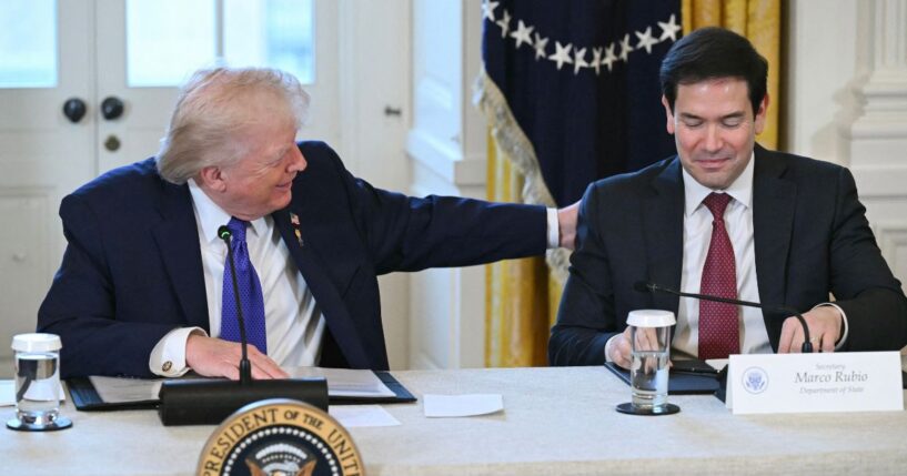 President Donald Trump speaks with Secretary of State Marco Rubio during a meeting with American oil executives in the East Room of the White House in Washington, DC on Jan. 9, 2026.