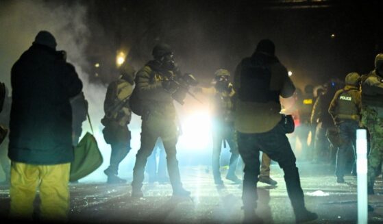 Federal agents fire tear gas into a crowd of Minneapolis rioters amid unrest in Minneapolis, Minnesota, on Jan. 14, 2026.