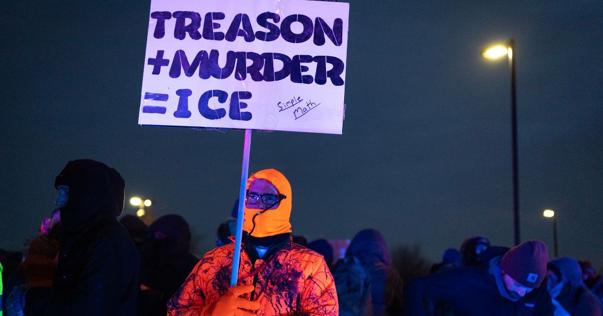 Gut-Punch: Image of Man Comforting Little Boy During Leftist Attack on Christians Should Be Seared Onto Our Brains Forever