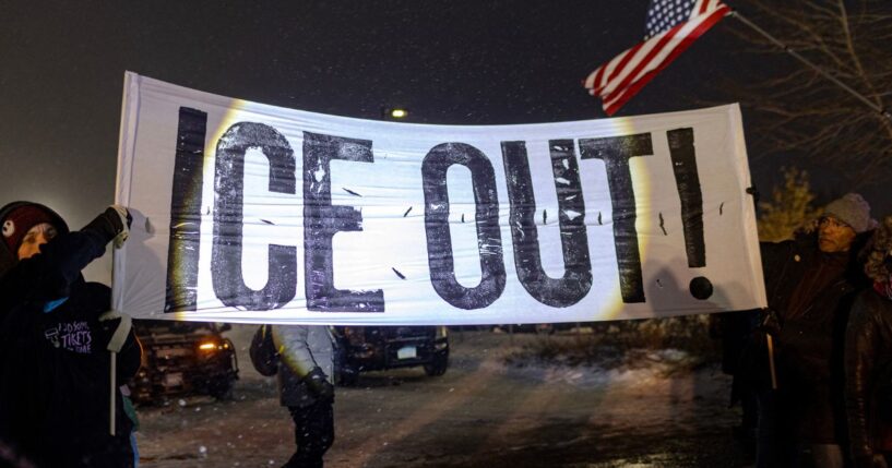 Protesters hold a large anti-ICE sign in Minneapolis, Minnesota on Jan. 18, 2026.