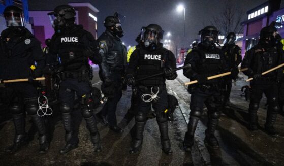 Minneapolis police form a line near so-called "protesters" and anti-ICE agitators in Maple Grove on the outskirts of Minneapolis, Minnesota, on Jan. 26, 2026.