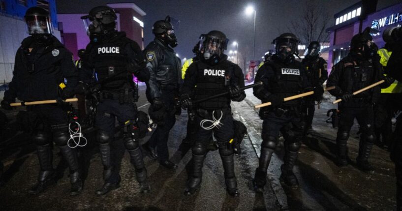 Minneapolis police form a line near so-called "protesters" and anti-ICE agitators in Maple Grove on the outskirts of Minneapolis, Minnesota, on Jan. 26, 2026.
