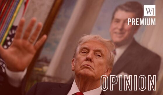 A portrait of former President Ronald Reagan hangs behind President Donald Trump as he makes an announcement on prescription drugs in the Oval Office of the White House in Washington, D.C., on Sept. 30, 2025.