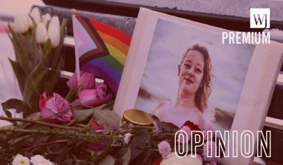 Flowers and candles are seen at a vigil for Renee Nicole Good in front of the United States embassy on Jan. 11, 2026, in Berlin, Germany.