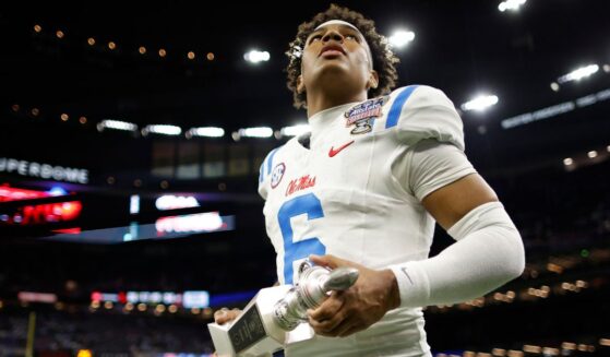 Trinidad Chambliss #6 of the Ole Miss Rebels holds the offensive player of the game trophy after defeating the Georgia Bulldogs during the 2025 College Football Playoff Quarterfinal at the Allstate Sugar Bowl at Caesars Superdome Thursday in New Orleans, Louisiana.