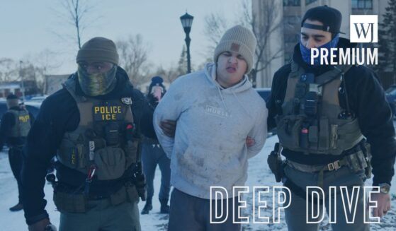 Federal immigration agents detain a man during an operation by Immigration and Customs Enforcement and Border Patrol in St. Paul, Minnesota, on Jan. 27, 2026.