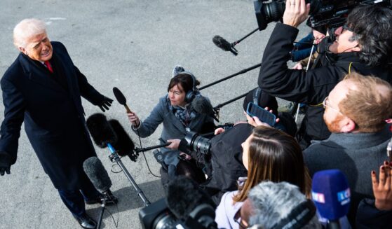 President Donald Trump speaks to the media on the South Lawn of the White House on Friday.