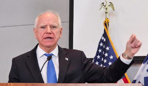 Minnesota Gov. Tim Walz gestures during a December news conference in St. Paul.