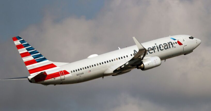 An American Airlines Boeing 737-800 takes off from Miami International Airport in a file photo dated Dec. 10, 2021. An American Airlines crew found a bullet hole in a similar plane after it landed in Colombia this week.