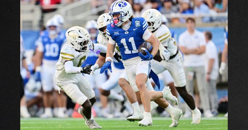 Parker Kingston #11 of the BYU Cougars runs with the ball in the first half against the Georgia Tech Yellow Jackets during the 2025 Pop-Tarts Bowl at Camping World Stadium on Dec. 27 in Orlando, Florida.