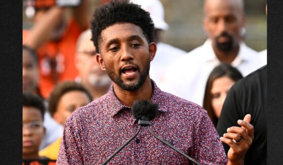 Baltimore Mayor Brandon Scott, left, speaks during a Sept. 5 news conference.