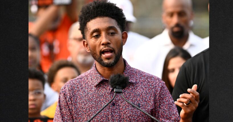 Baltimore Mayor Brandon Scott, left, speaks during a Sept. 5 news conference.