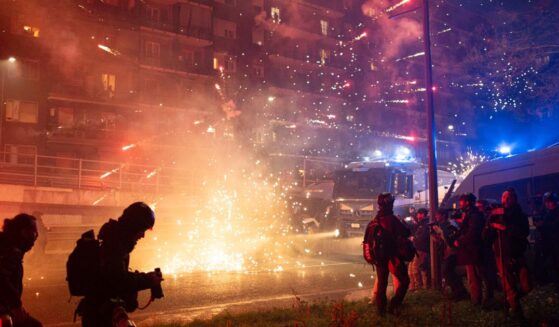 Police use water cannons and tear gas to drive away protesters during a protest over the Milan Cortina 2026 Olympics on Feb. 7, 2026, in Milan, Italy.