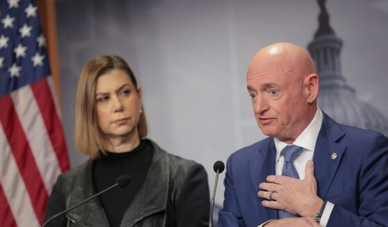 Sen. Elissa Slotkin listens as Sen. Mark Kelly speaks on the failed grand jury indictment against them during a news conference at the U.S. Capitol on Feb. 11, 2026, in Washington, D.C.