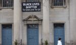A Black Lives Matter sign hangs in front of the First Congregational Church of Evanston UCC on March 23, 2021, in Evanston, Illinois.