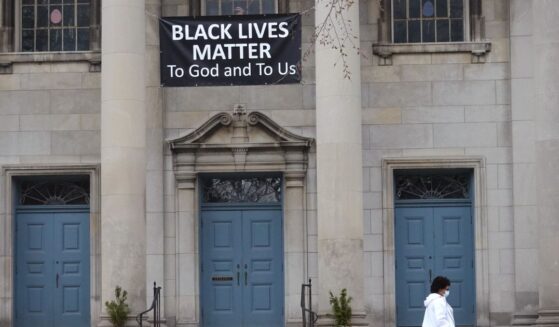 A Black Lives Matter sign hangs in front of the First Congregational Church of Evanston UCC on March 23, 2021, in Evanston, Illinois.