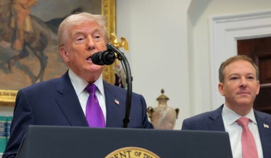 President Donald Trump speaks alongside Environmental Protection Agency Administrator Lee Zeldin during an event to announce a rollback of the 2009 Endangerment Finding in the Roosevelt Room at the White House on Feb. 12, 2026, in Washington, D.C.