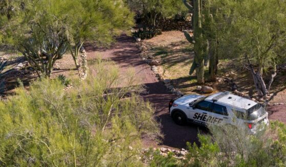 In an aerial view, a Pima County Sheriff's deputy keeps guard outside of Nancy Guthrie's residence on Feb. 15, 2026, in Tucson, Arizona.