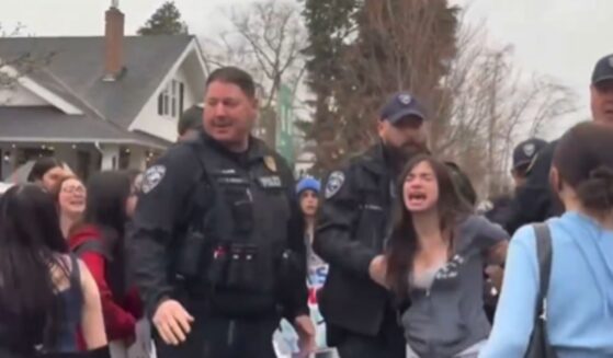 A young woman was arrested during an anti-ICE protest at Enumclaw High School in Washington state on Feb. 13, 2026.