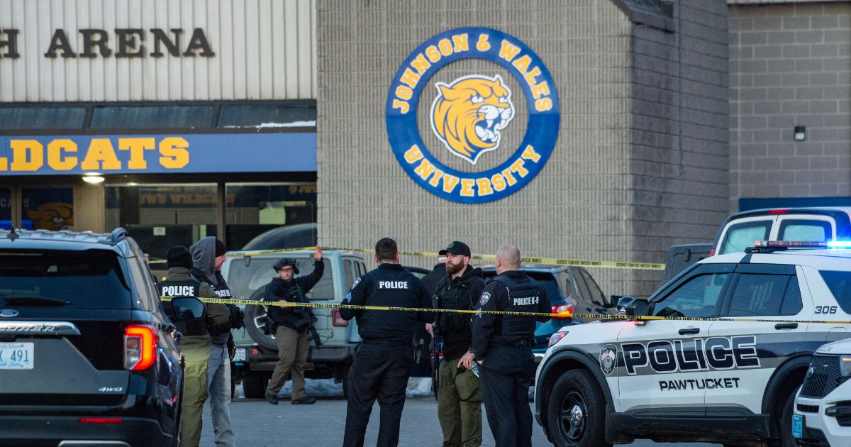 Police stand outside the perimeter they created around the Dennis M. Lynch Arena where a shooting occurred earlier today in Pawtucket, Rhode Island, on Feb. 16, 2026.