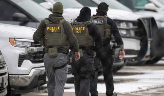 ICE agents depart the Bishop Henry Whipple Federal Building on Feb. 4, 2026, in Minneapolis, Minnesota.