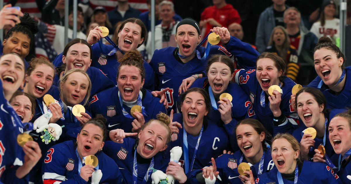 Gold medalist Team United States pose after the medal ceremony for the Ice Hockey Women following the Women's Gold Medal match between the United States and Canada on day 13 of the Milano Cortina 2026 Winter Olympic games at Milano Santagiulia Ice Hockey Arena on Feb. 19, 2026, in Milan, Italy.