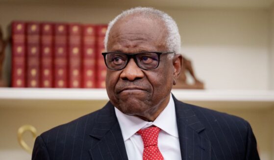 Supreme Court Associate Justice Clarence Thomas, seen in a 2025 photo, wrote a blistering dissent on the tariff ruling.