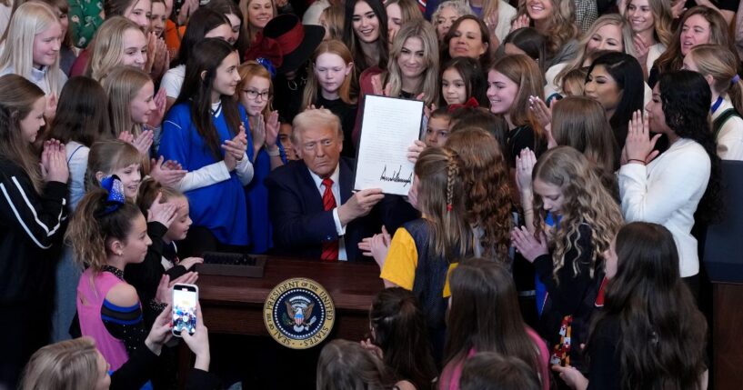 President Donald Trump was joined by women athletes as he signed the “No Men in Women’s Sports” executive order in the East Room at the White House on Feb. 5, 2025.