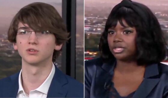 Republican voter Ajua Mason, right, told Brett Trussell, left, that it is "completely outrageous" to suggest minorities are not educated enough to obtain voter ID documents.