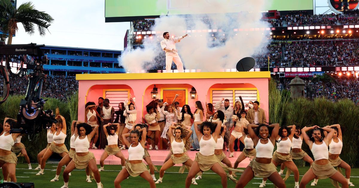 Bad Bunny performs onstage during Sunday's Super Bowl LX Halftime Show. Viewership data indicates millions tuned out when the raunchy rapper's show started.