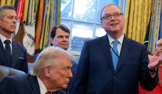 U.S. Director of the National Economic Council Kevin Hassett, right, speaks during a Dec. 3 Oval Office meeting with President Donald Trump,