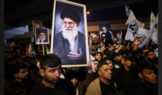 Iraqi Shiites carry a portrait of Iran's Supreme Leader Ayatollah Ali Khamenei during a protest Saturday against U.S. and Israeli attacks on Iran. News sources were reporting that Khameni has be