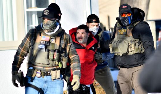 Federal immigration agents detain a man during an ICE and border patrol operation in St. Paul, Minnesota, on Jan. 27, 2026.
