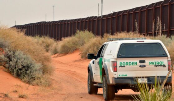 U.S. Border Patrol agent drives near the U.S.-Mexico border fence in Santa Teresa, New Mexico on April 6, 2016.