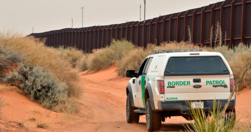 U.S. Border Patrol agent drives near the U.S.-Mexico border fence in Santa Teresa, New Mexico on April 6, 2016.
