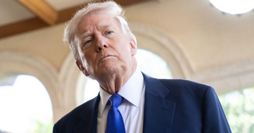 President Donald Trump speaks to the press as he arrives to the wedding of White House Deputy Chief of Staff Dan Scavino and Department of State Director of Art in Embassies Erin Elmore at Mar-a-Lago in Palm Beach, Florida, on Feb. 1, 2026.