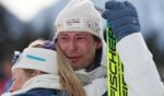 Bronze medalist Sturla Holm Laegreid of Team Norway embraces teammate Ingrid Landmark Tandrevold in Anthill-Anterselva, Italy, on Feb. 10, 2026.