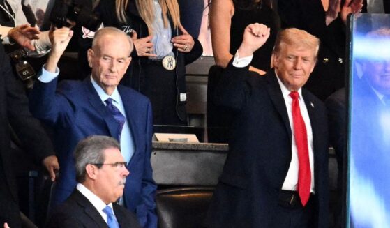 U.S. President Donald Trump and Bill O'Reilly gesture in the crowd at an MLB match between the New York Yankees and Detroit Tigers in New York on Sept. 11, 2025.