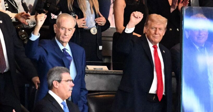 U.S. President Donald Trump and Bill O'Reilly gesture in the crowd at an MLB match between the New York Yankees and Detroit Tigers in New York on Sept. 11, 2025.