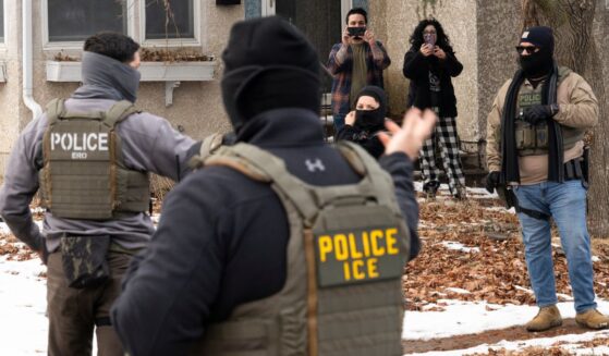 ICE agents are surrounded by so-called observers and potential agitators in Minneapolis, Minnesota.